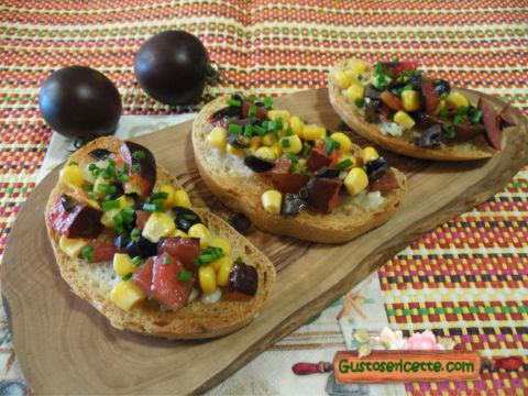 Bruschetta pomodorini viola cocktail e mais